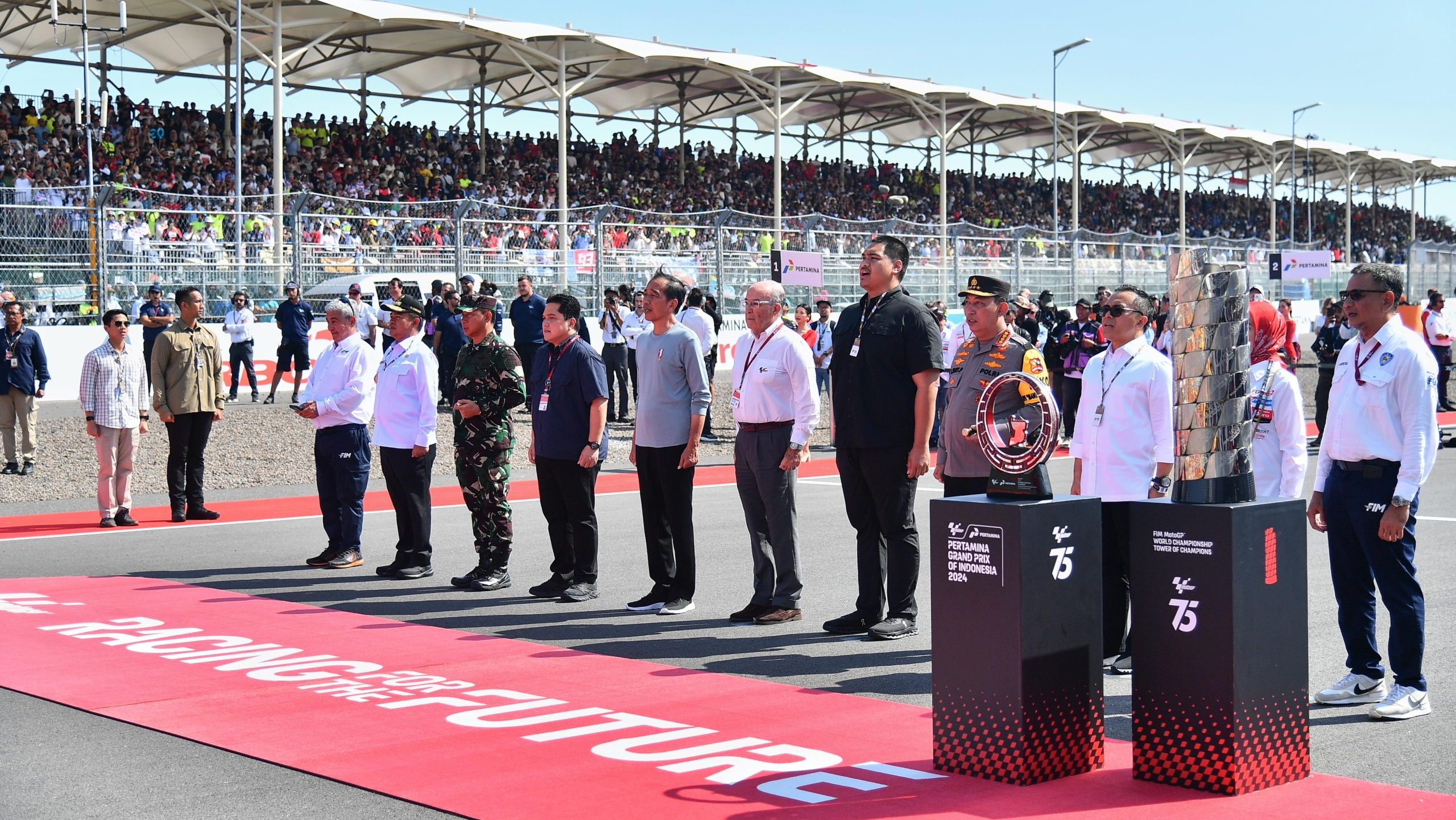 President Jokowi watches and hands over the 2024 Pertamina Indonesia Grand Prix champion trophy